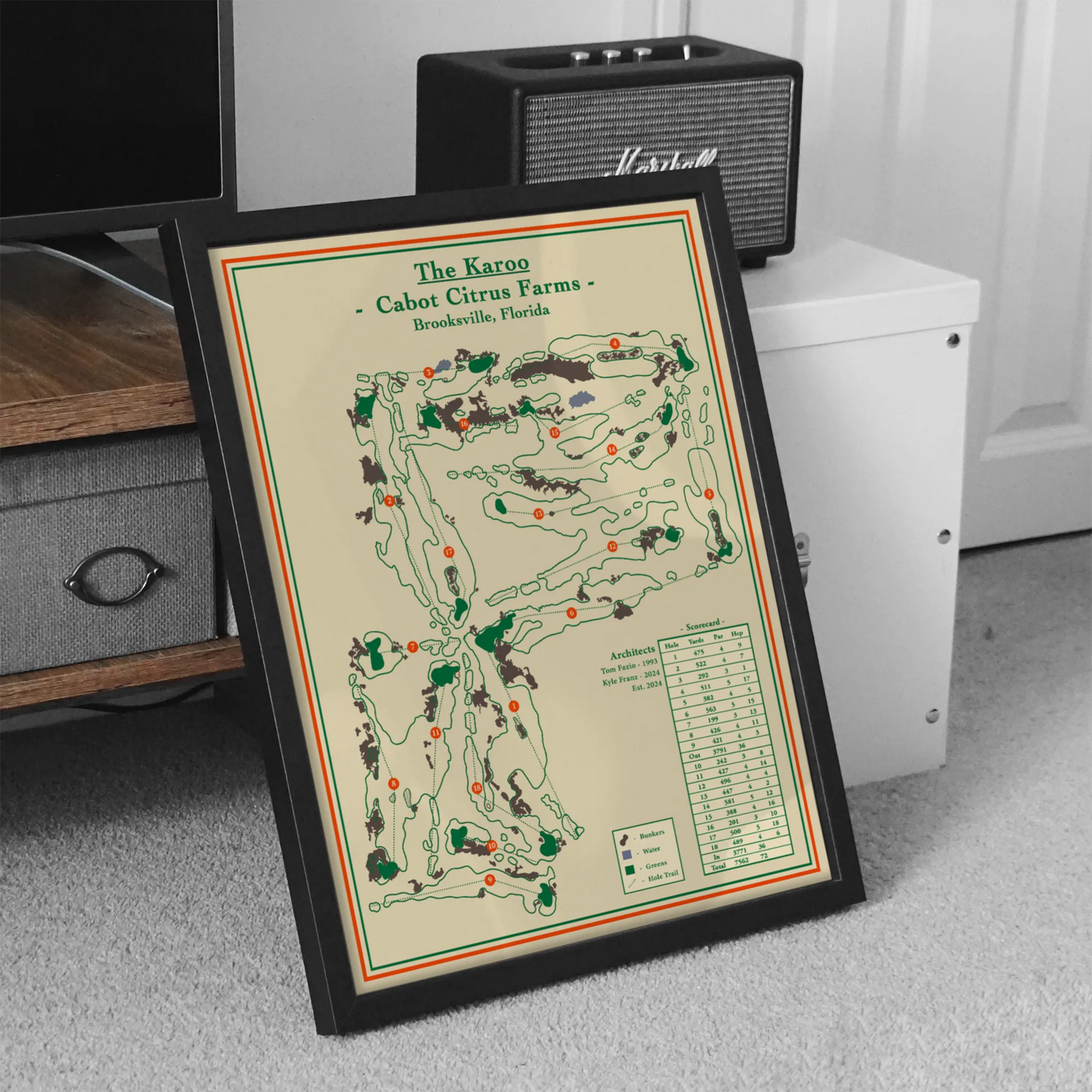 Framed map of Cabot Citrus Farms on a carpeted floor with a Marshall amplifier in the background.