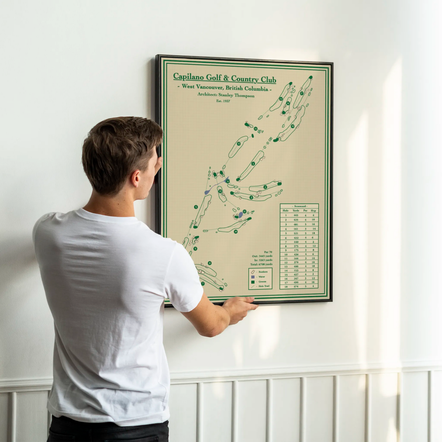 framed golf map of Capilano Golf & Country Club on a white wall.