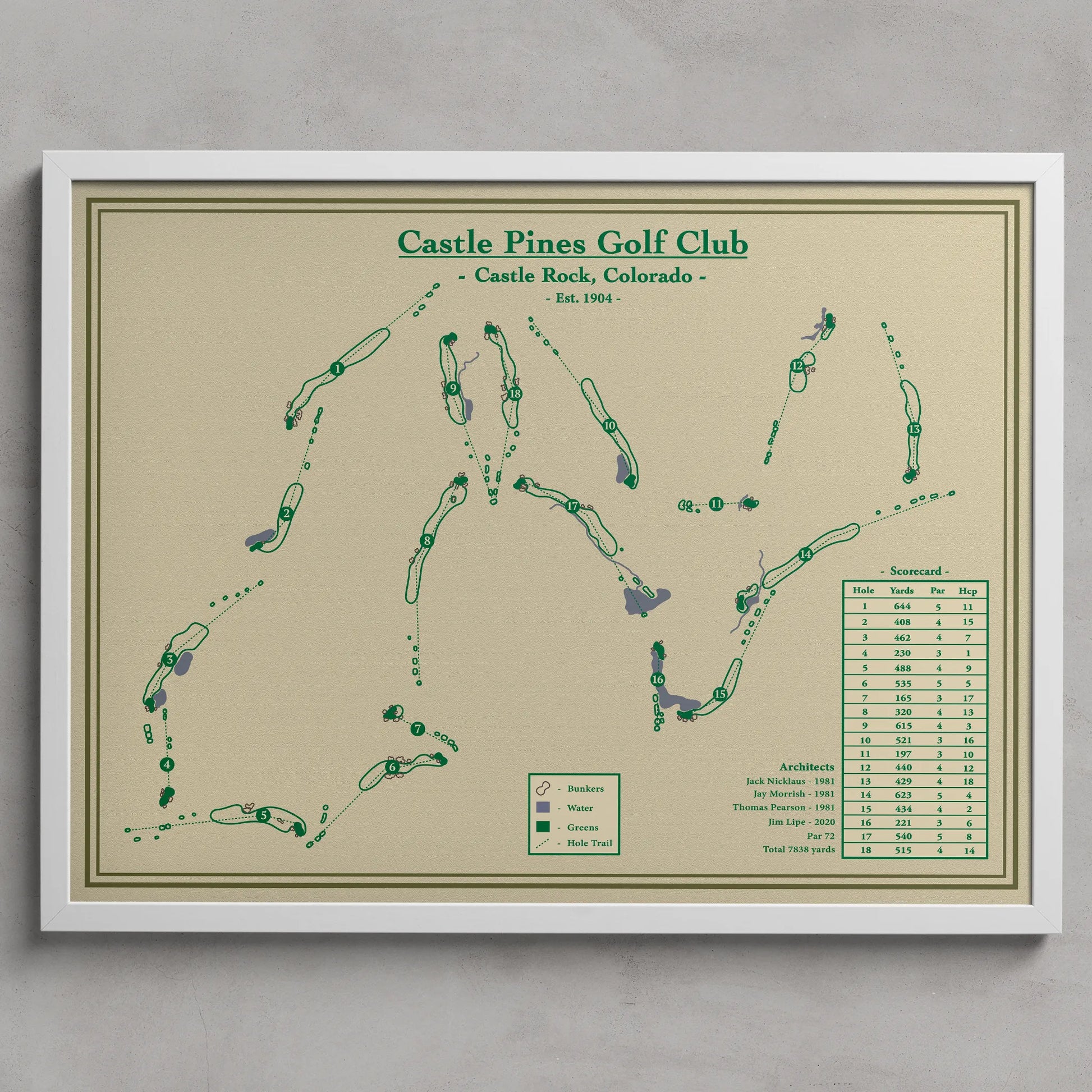 Framed map of Castle Pines Golf Club with green text on a beige background