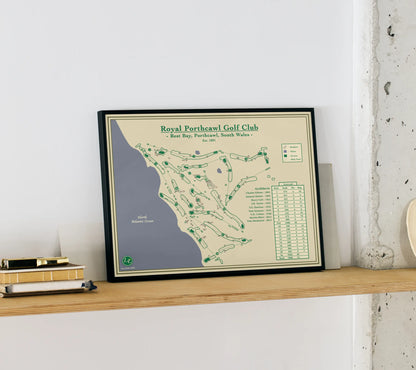 Framed map of Royal Perthawl Golf Club on a wooden shelf against a white wall.