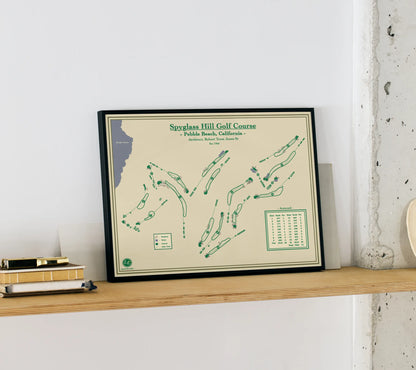 Framed golf course map onf spyglass hill golf course on a shelf against a white wall