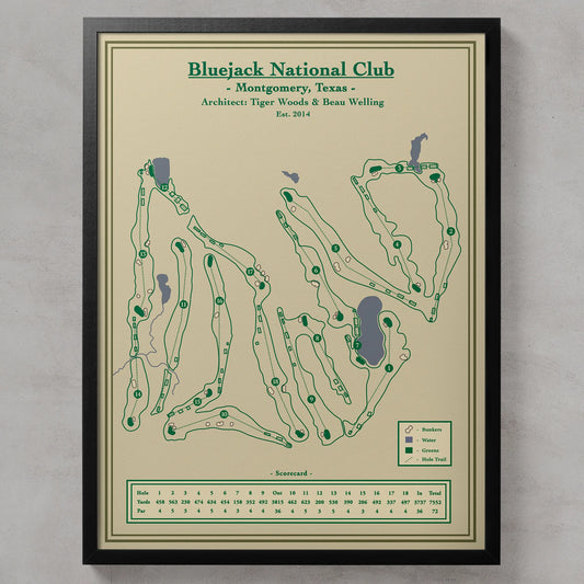 Bluejack National course map in a black wood frame showing the Tiger Woods design winding through towering Texas pines.