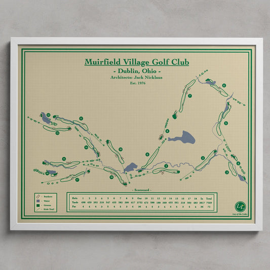 Muirfield Village Golf Club map print hanging on a light gray wall. The print features a golf course layout with green paths, blue water features, and a beige background with green and black text.