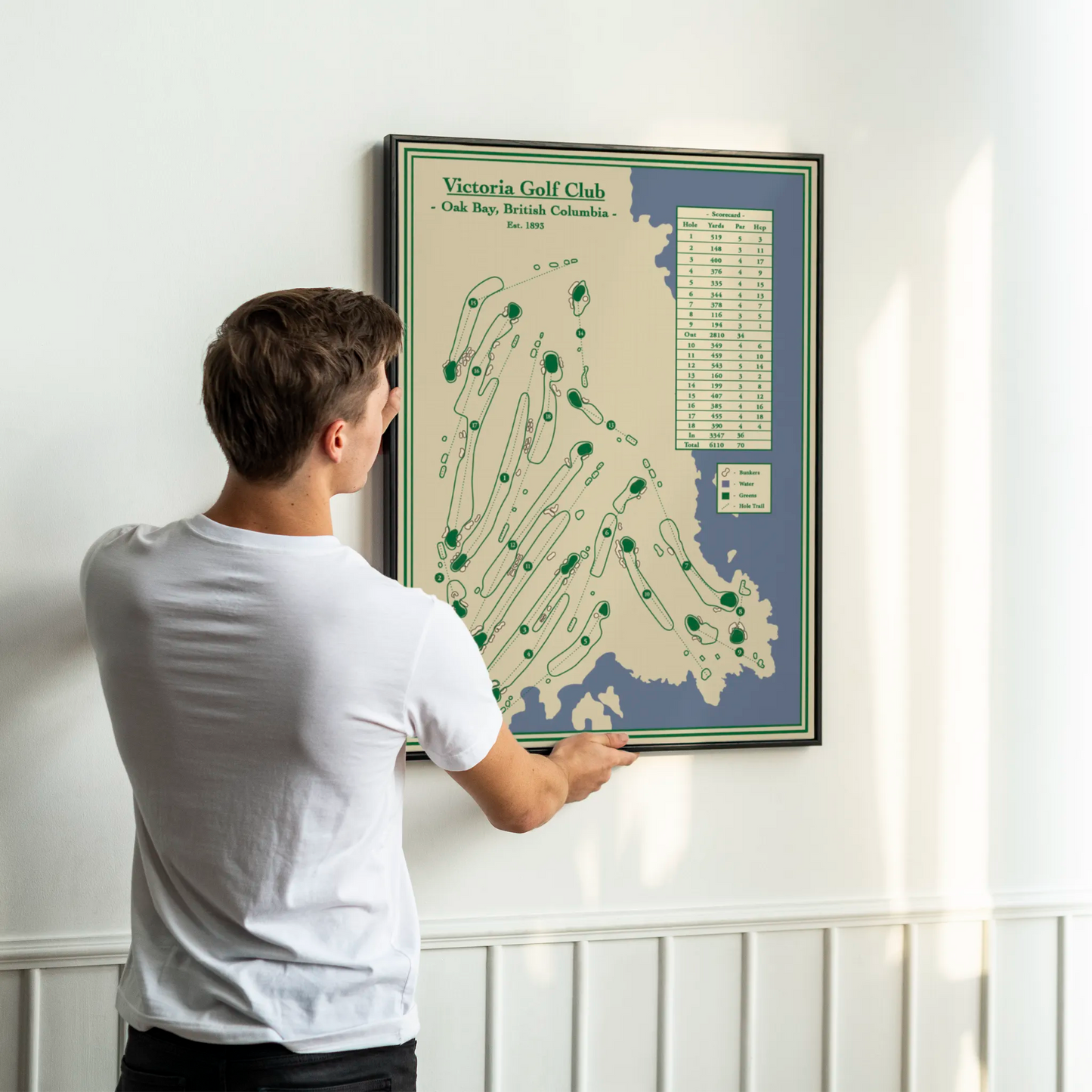 golf map of Victoria Golf Club, Oak Bay, British Columbia, hanging on a white wall.