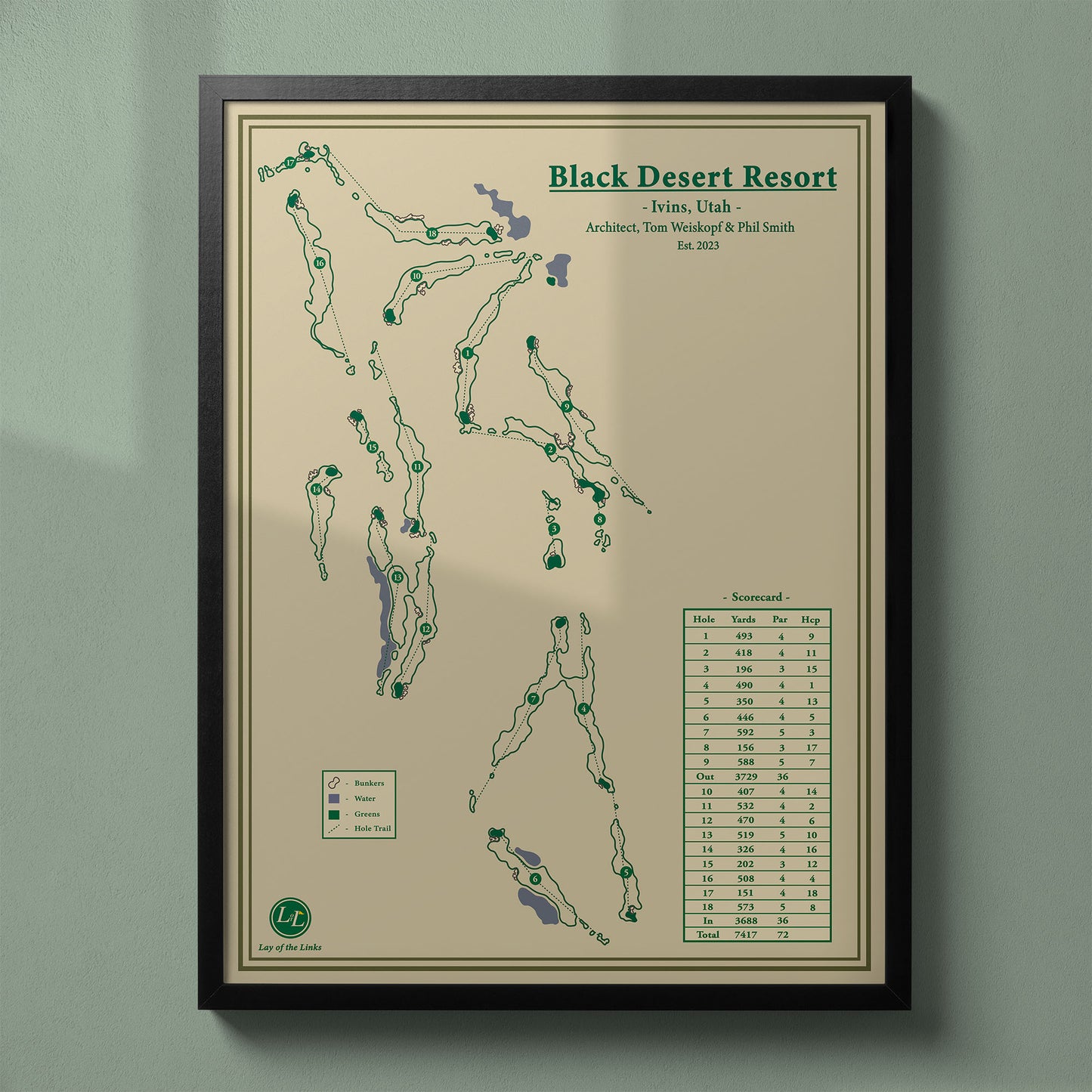 Framed Black Desert Resort Golf Course map in a black wood frame showing the Tom Weiskopf design amidst black lava.