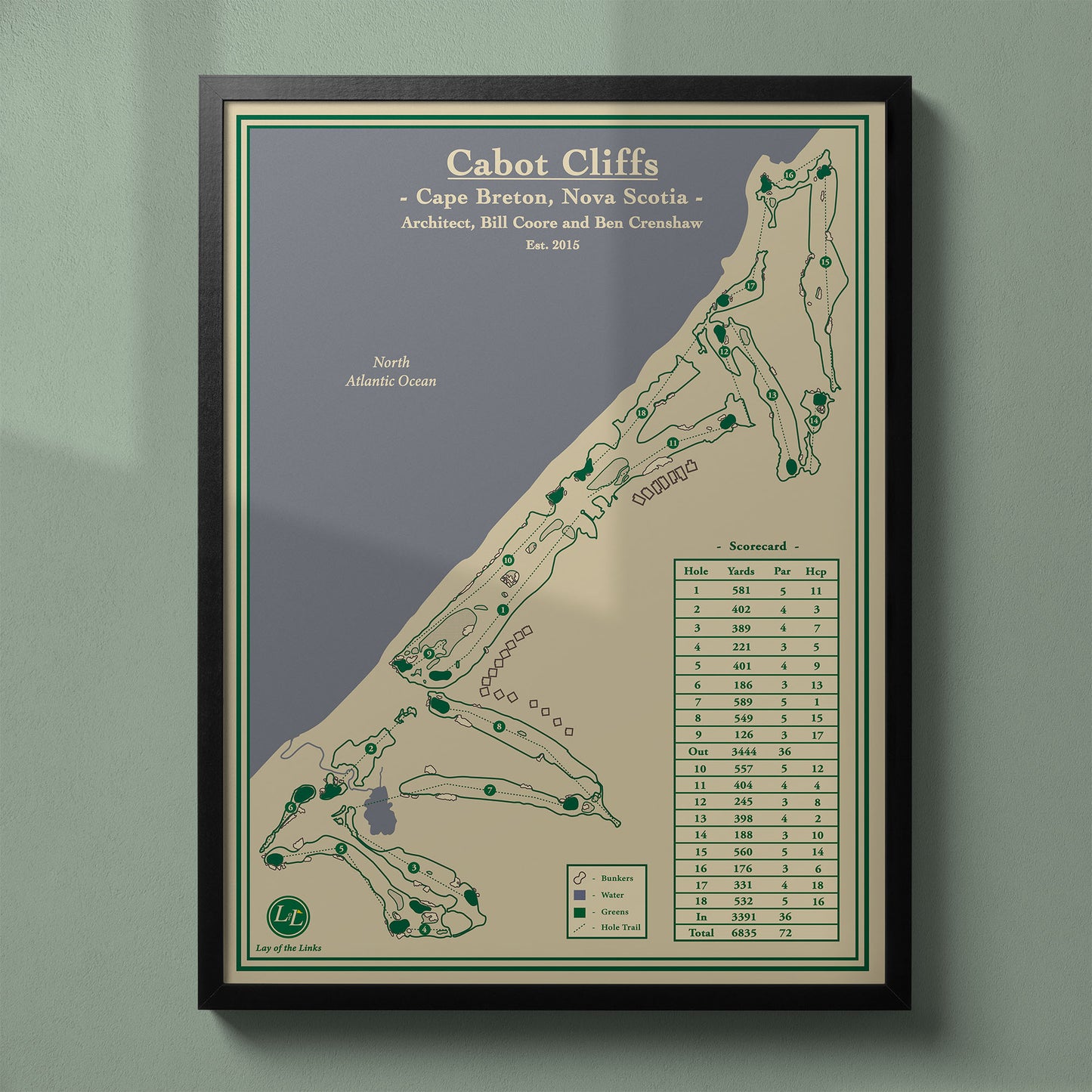 Framed Cabot Cliffs map in a black wood frame showing the Coore & Crenshaw design and dramatic ocean drops.