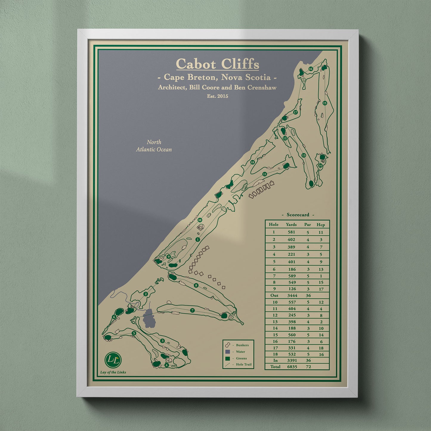 Cabot Cliffs map print in a white frame, featuring the #1 ranked course in Canada in Inverness, Nova Scotia.