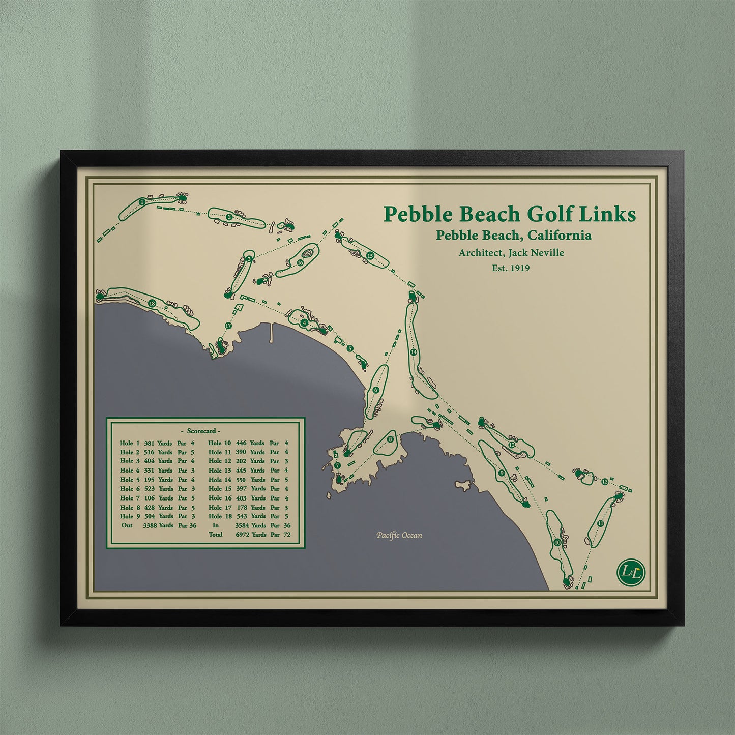 Framed Pebble Beach Golf Links map in a black wood frame showing the rugged coastline and cliffs.