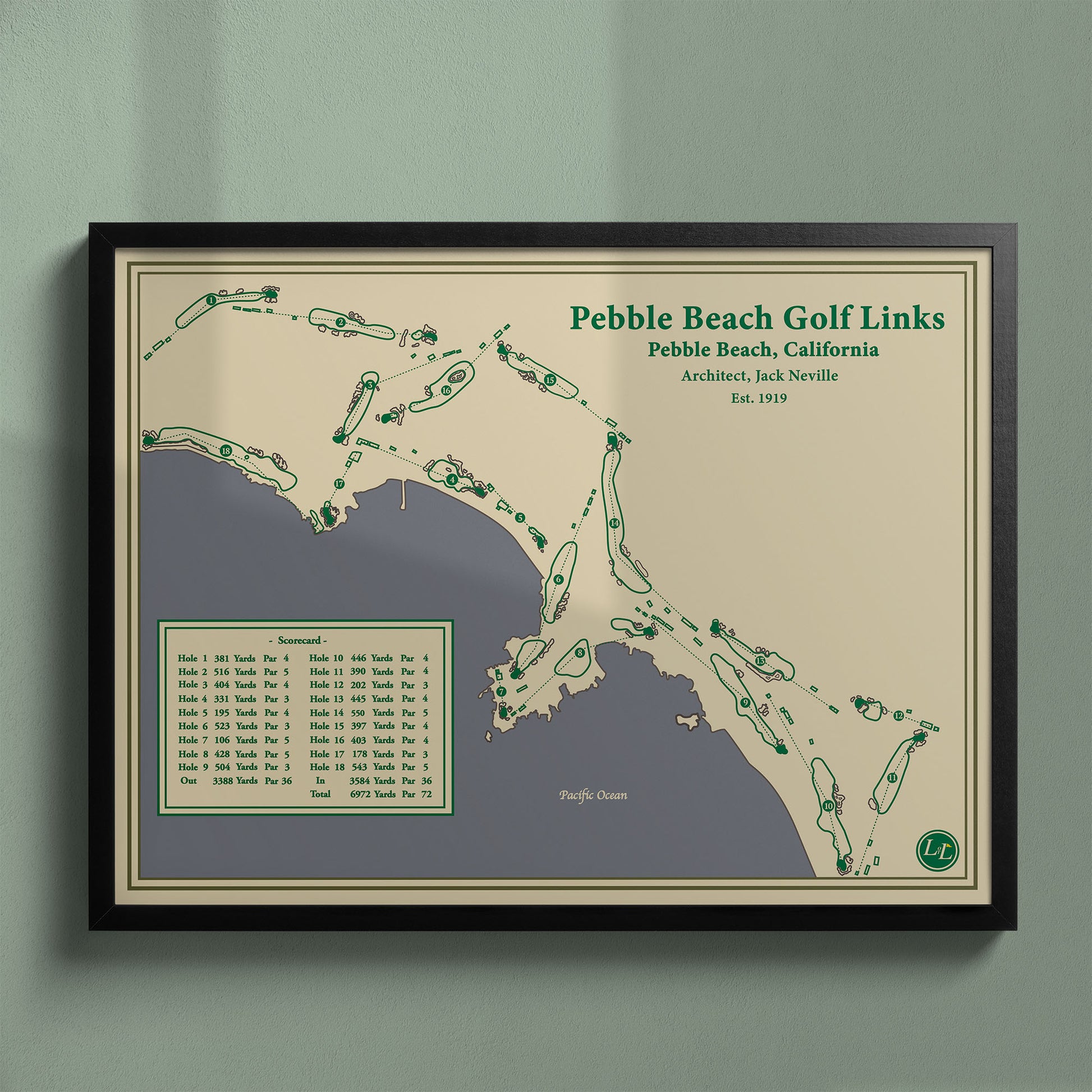 Framed Pebble Beach Golf Links map in a black wood frame showing the rugged coastline and cliffs.
