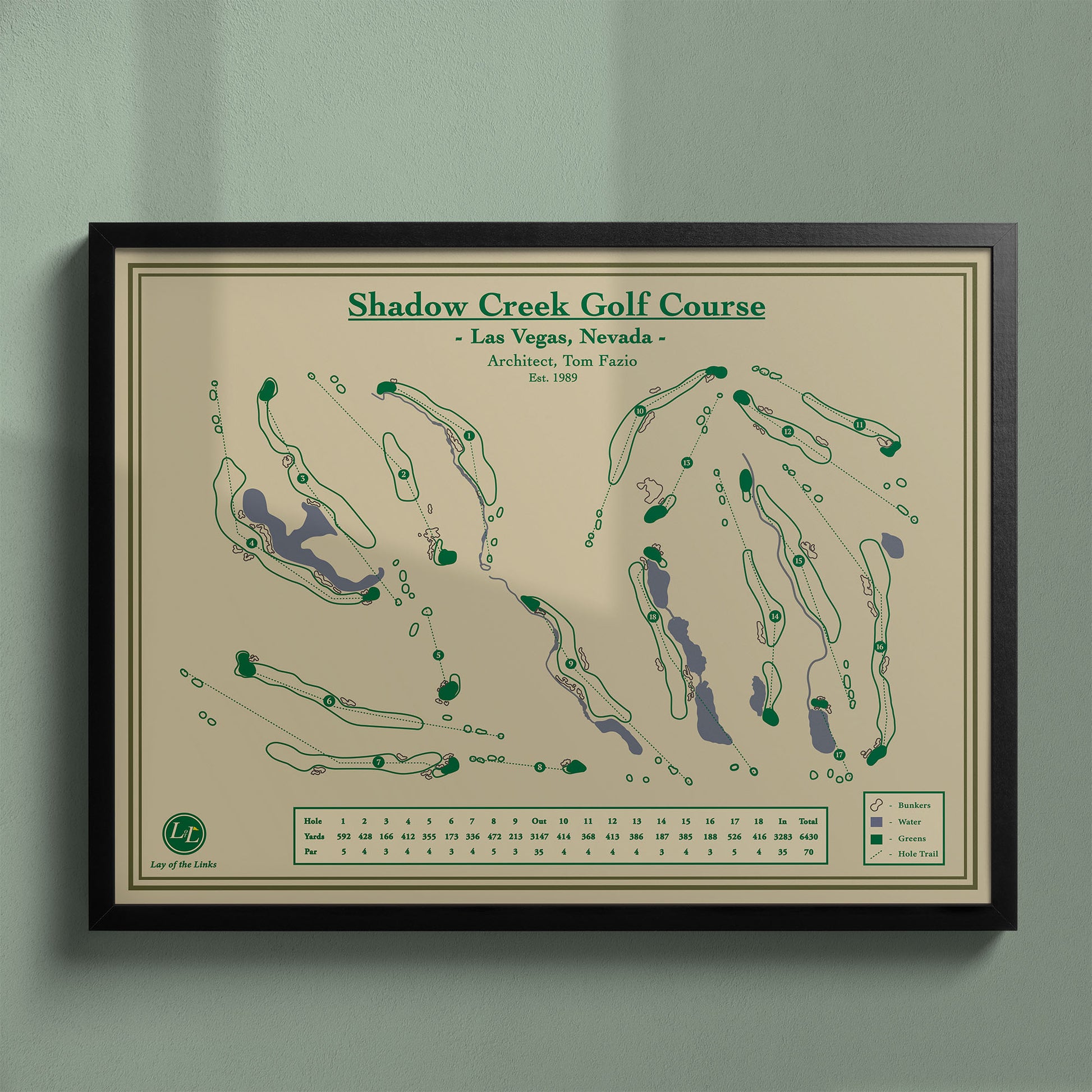 Framed Shadow Creek Golf Course map in a black wood frame showing the Tom Fazio design and man-made oasis.