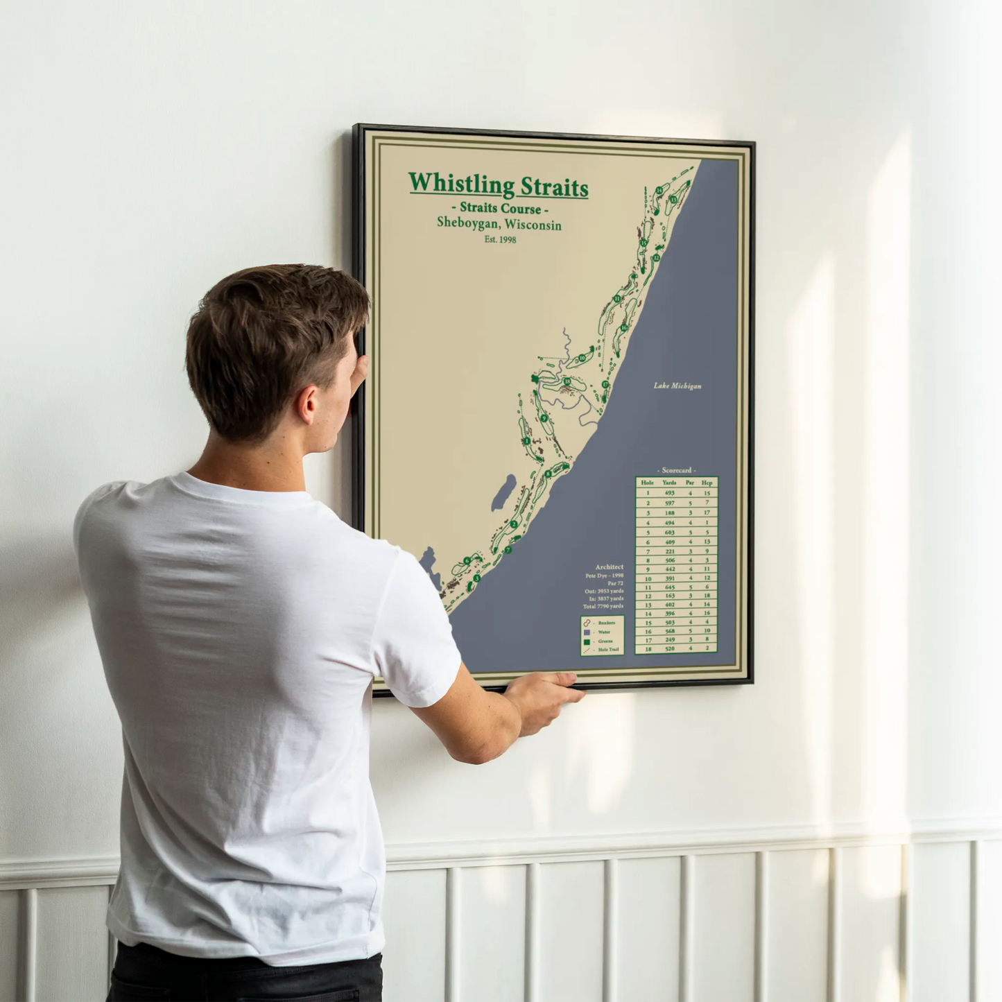 framed map of Whistling Straits golf course on a white wall.